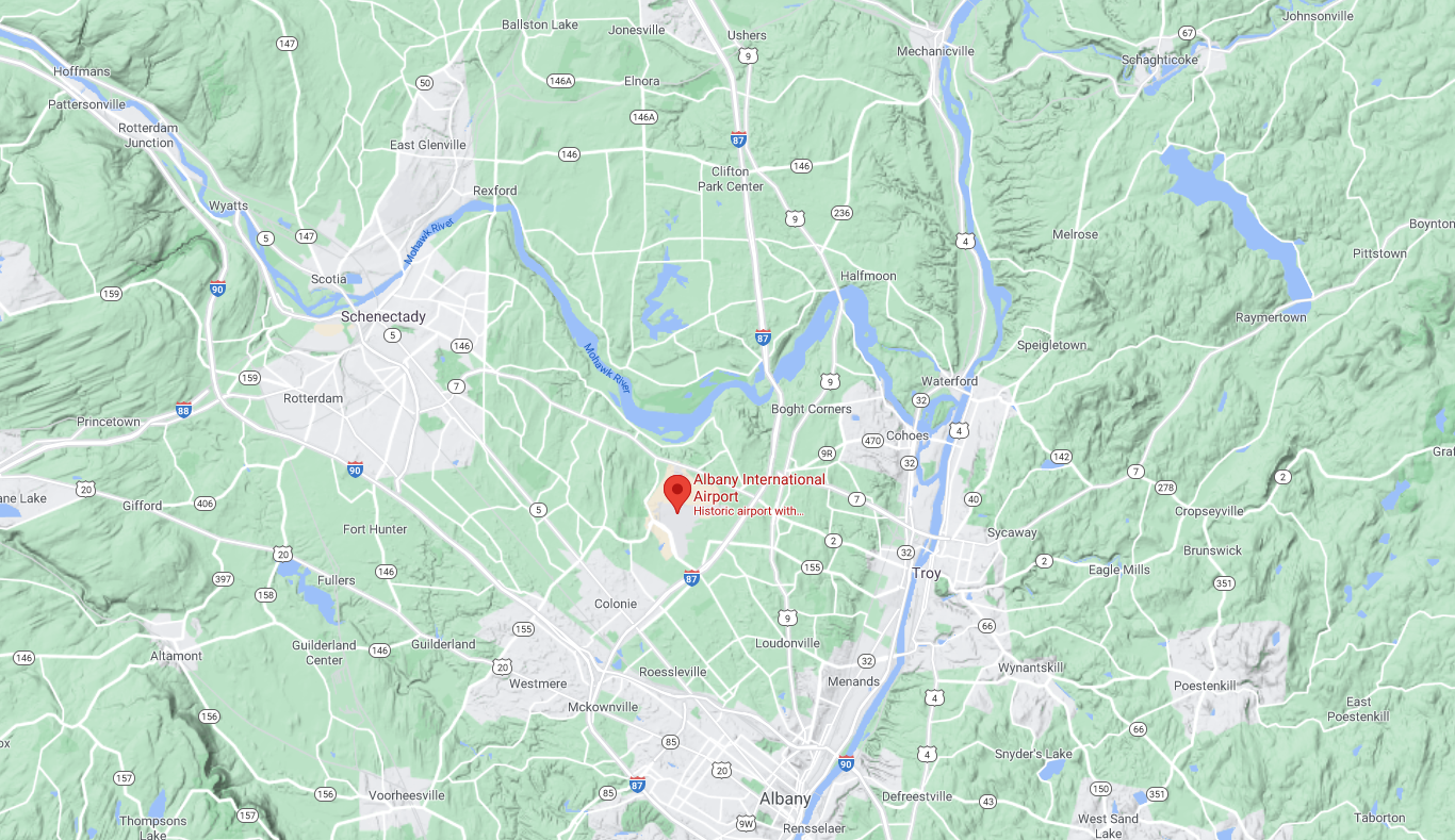 Map of Albany, New York area showing Albany International Airport with surrounding towns, roads, and natural features.